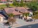 Aerial view of a house with a large front yard and desert landscaping at 2596 E Desert Wind Dr, Casa Grande, AZ 85194