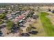 Aerial view showcasing a house's location within a golf course community at 2596 E Desert Wind Dr, Casa Grande, AZ 85194