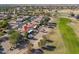 Aerial view showcasing a house's location within a golf course community at 2596 E Desert Wind Dr, Casa Grande, AZ 85194