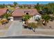 Single story home with attached two car garage and mature landscaping at 2596 E Desert Wind Dr, Casa Grande, AZ 85194