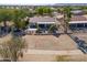 Aerial view of a house with a backyard patio and surrounding landscape at 2596 E Desert Wind Dr, Casa Grande, AZ 85194