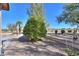 Landscaped backyard with mature citrus tree and golf course view at 2596 E Desert Wind Dr, Casa Grande, AZ 85194
