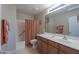 Clean bathroom with shower/tub combo, vanity, and plenty of storage at 2596 E Desert Wind Dr, Casa Grande, AZ 85194