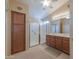 Main bathroom with double vanity and shower at 2596 E Desert Wind Dr, Casa Grande, AZ 85194