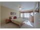 Bedroom with double bed, dresser, and window seating area at 2596 E Desert Wind Dr, Casa Grande, AZ 85194