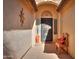 Entryway with decorative door, wood bench, and terracotta pot at 2596 E Desert Wind Dr, Casa Grande, AZ 85194