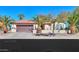 One-story home with brown garage door and desert landscaping at 2596 E Desert Wind Dr, Casa Grande, AZ 85194