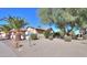 Single story home with mature trees and desert landscaping at 2596 E Desert Wind Dr, Casa Grande, AZ 85194