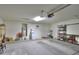 Two-car garage with extra storage shelving and utility sink at 2596 E Desert Wind Dr, Casa Grande, AZ 85194