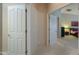 Hallway with doors leading to bedrooms and bathroom at 2596 E Desert Wind Dr, Casa Grande, AZ 85194
