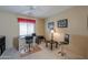 Well-lit home office space with a desk, chair, and ample room to work at 2596 E Desert Wind Dr, Casa Grande, AZ 85194
