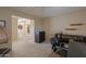 Spacious home office with desk and chair, plus access to another room at 2596 E Desert Wind Dr, Casa Grande, AZ 85194