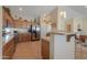 Well-equipped kitchen featuring stainless steel appliances and wood cabinets at 2596 E Desert Wind Dr, Casa Grande, AZ 85194