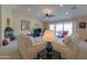 Bright living room with vaulted ceilings, fireplace, and patio access at 2596 E Desert Wind Dr, Casa Grande, AZ 85194