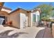 Outdoor patio with seating area, fire pit and decorative bells at 2596 E Desert Wind Dr, Casa Grande, AZ 85194