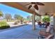 Large covered patio with seating area and ceiling fans at 2596 E Desert Wind Dr, Casa Grande, AZ 85194