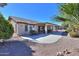 Spacious covered patio, perfect for outdoor entertaining, overlooks a beautifully landscaped backyard at 2596 E Desert Wind Dr, Casa Grande, AZ 85194