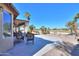 Relaxing patio with wicker furniture and view of the golf course at 2596 E Desert Wind Dr, Casa Grande, AZ 85194