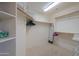 Spacious walk-in closet with ample shelving and hanging rods at 2596 E Desert Wind Dr, Casa Grande, AZ 85194