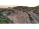 Aerial view of a desert lot with a long driveway leading to a house at 2809 E Frye Rd, Phoenix, AZ 85048