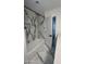 Clean bathroom with shower/tub combo and marble floors at 2809 E Frye Rd, Phoenix, AZ 85048