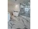 Luxurious bathroom with a freestanding soaking tub, a large walk-in shower, and marble tile at 2809 E Frye Rd, Phoenix, AZ 85048