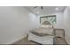 Charming bedroom with unique headboard and nightstand at 2809 E Frye Rd, Phoenix, AZ 85048