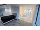 Spacious bedroom with ensuite bath, featuring a soaking tub and walk-in shower at 2809 E Frye Rd, Phoenix, AZ 85048