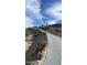 Modern house on a hill with a long driveway and desert landscape at 2809 E Frye Rd, Phoenix, AZ 85048