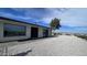 Modern home exterior featuring a large window and a gravel pathway at 2809 E Frye Rd, Phoenix, AZ 85048