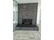 Modern fireplace with dark gray tile surround and built-in wine storage at 2809 E Frye Rd, Phoenix, AZ 85048