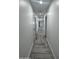 Bright hallway with light walls and wood-look tile flooring at 2809 E Frye Rd, Phoenix, AZ 85048