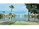 Calm lake view with palm trees, houses, and a central fountain at 2809 E Frye Rd, Phoenix, AZ 85048