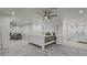 Large main bedroom with a white wooden bed frame and en-suite bathroom at 2809 E Frye Rd, Phoenix, AZ 85048