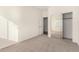 Spacious bedroom with mirrored closet doors at 44438 W Canyon Creek Dr, Maricopa, AZ 85139