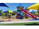 Colorful playground with slides, climbing structures, and shade canopies at 4446 W Hower Rd, Phoenix, AZ 85086