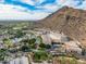 Aerial view of luxury resort with pool and mountain backdrop at 4710 N 65Th St, Scottsdale, AZ 85251