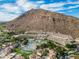Aerial view showing resort buildings, pool, and mountain views at 4710 N 65Th St, Scottsdale, AZ 85251