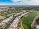 Aerial view of community near golf course and lake at 4710 N 65Th St, Scottsdale, AZ 85251