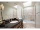 Bathroom with dark vanity and walk-in shower at 4710 N 65Th St, Scottsdale, AZ 85251