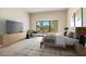 Relaxing bedroom with sliding doors leading to a private patio at 4710 N 65Th St, Scottsdale, AZ 85251