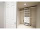 White built-in closet with drawers and shelves at 4710 N 65Th St, Scottsdale, AZ 85251