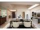 Bright dining room with a modern table and access to the entryway at 4710 N 65Th St, Scottsdale, AZ 85251