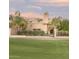 Tan stucco house with a gated entry and large yard at 4710 N 65Th St, Scottsdale, AZ 85251