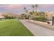 Landscaped walkway alongside a lush green golf course at 4710 N 65Th St, Scottsdale, AZ 85251