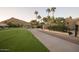 Landscaped walkway alongside a lush green golf course at 4710 N 65Th St, Scottsdale, AZ 85251