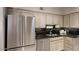 Kitchen with stainless steel appliances and dark granite countertops at 4710 N 65Th St, Scottsdale, AZ 85251