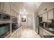 Kitchen boasts stainless steel appliances and light-colored cabinetry at 4710 N 65Th St, Scottsdale, AZ 85251