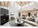 Spacious living room with high ceilings and a cozy fireplace at 4710 N 65Th St, Scottsdale, AZ 85251