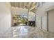 Spacious living room with marble floors and fireplace at 4710 N 65Th St, Scottsdale, AZ 85251